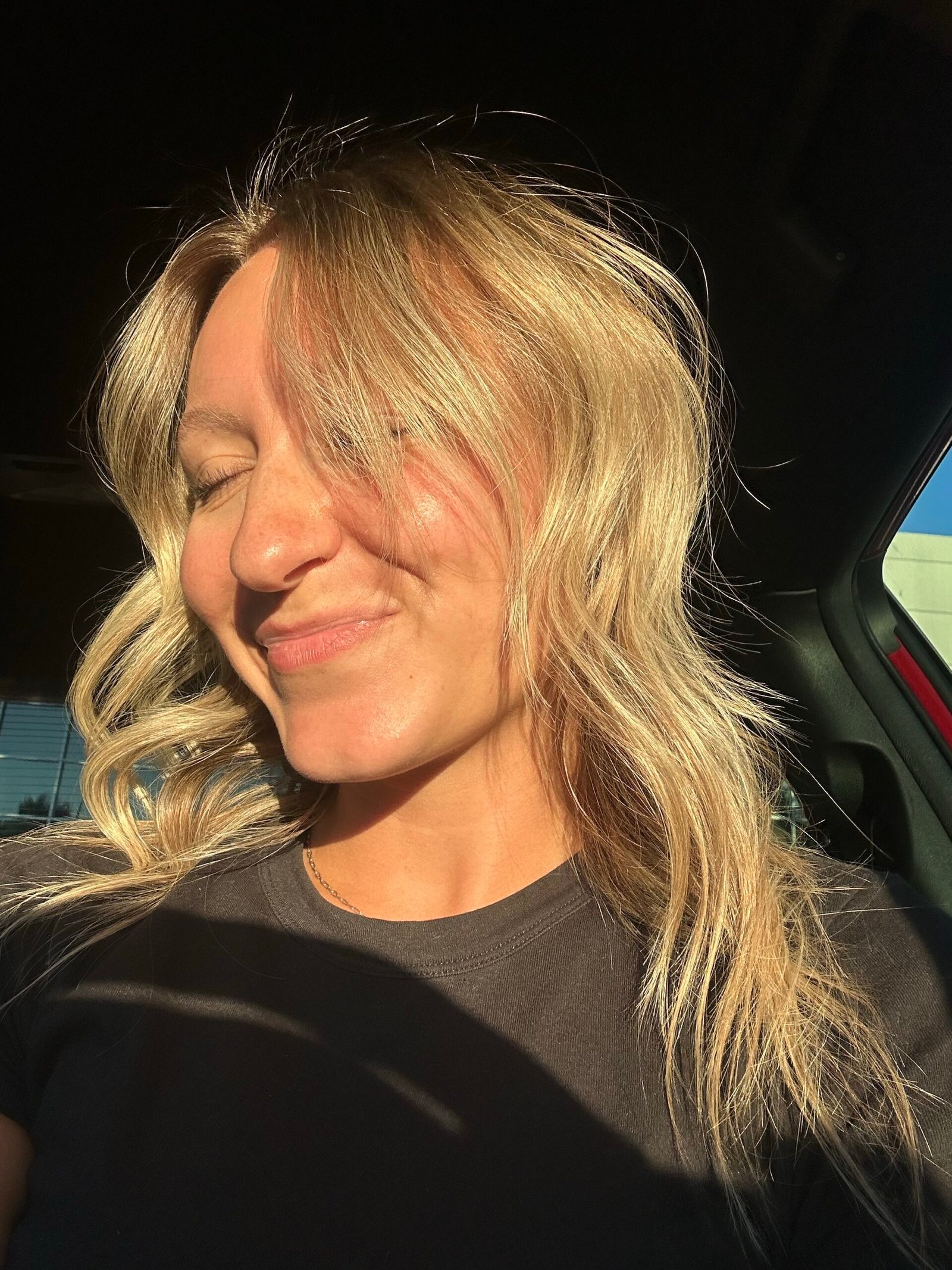 Woman with natural glowing skin in morning sunlight