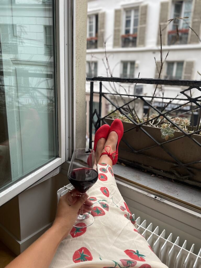 Quiet screen-free relaxation moment by a window with a drink